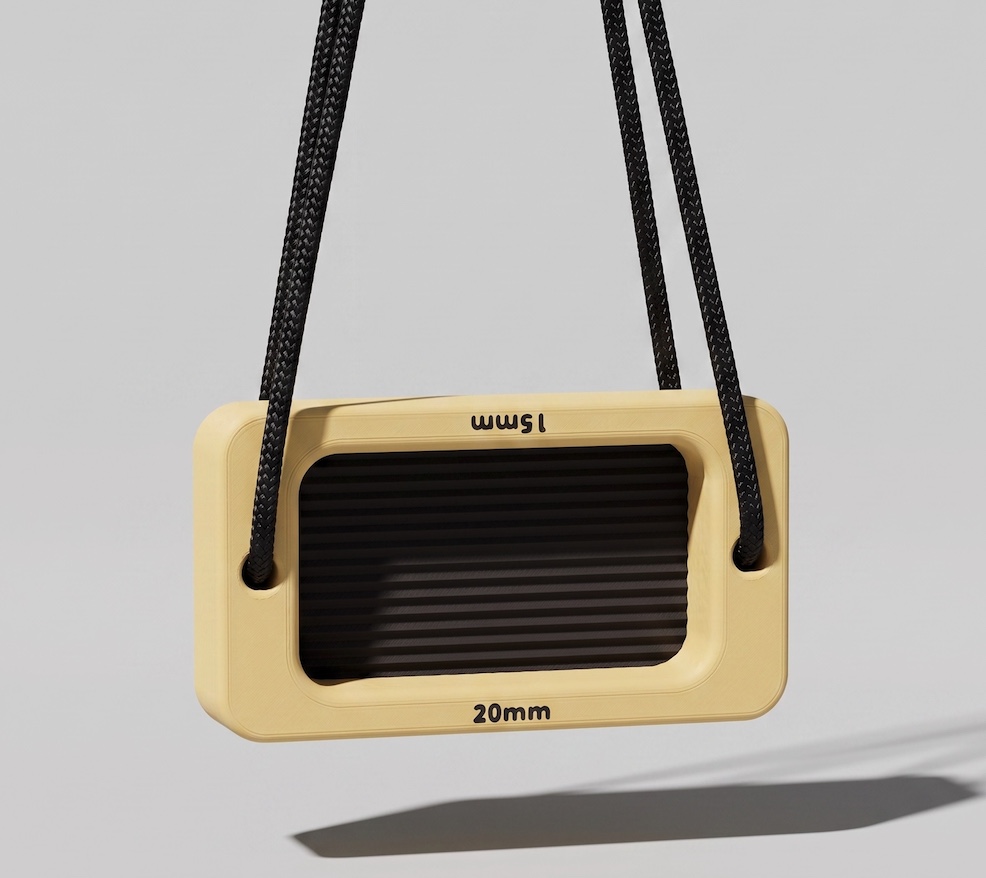 Soft Lemon and Charcoal DAB BLOCK 01 hanging from black cord in a studio product view